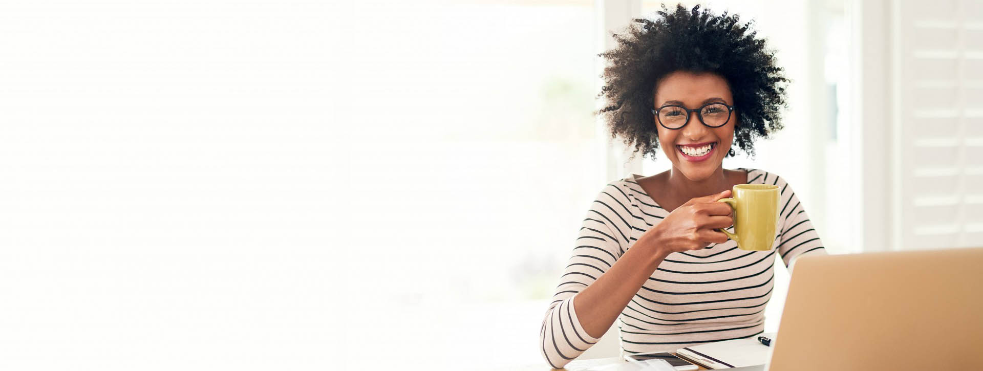 Woman Wearing Glasses and Smiling At Computer
